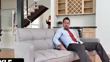 Stepfather in the living room fucks a blonde stepdaughter while a red-haired stepmother has fun with her stepson